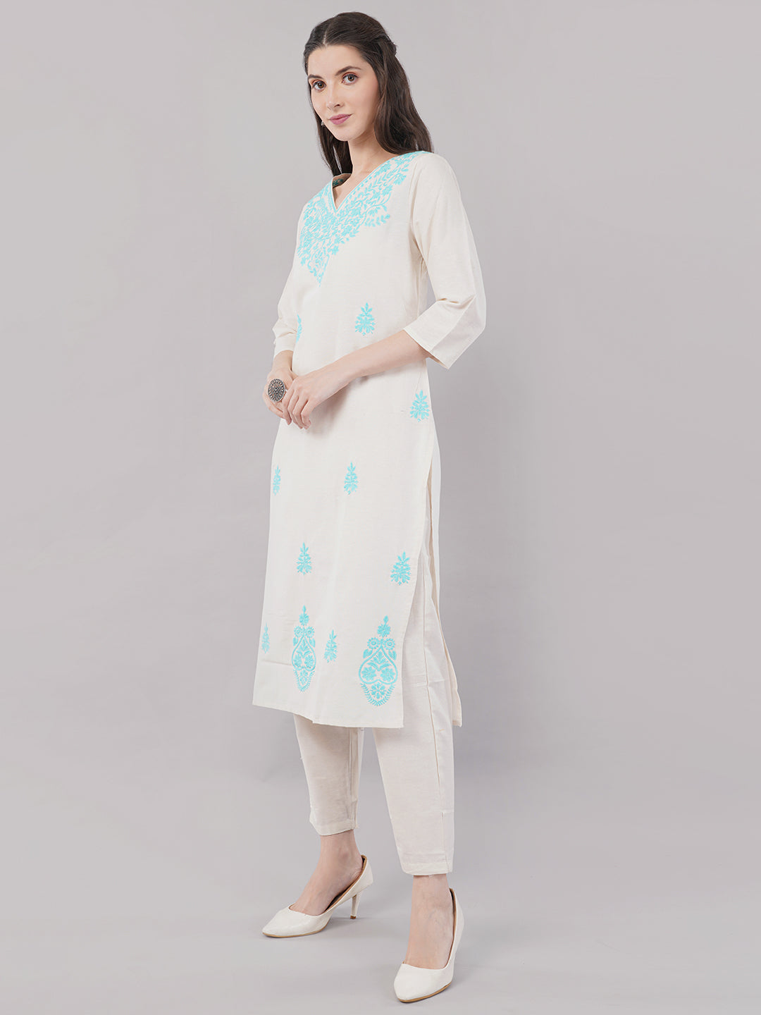 Off-white with  turquoise blue embroideryStraight-cut kurta adorned with intricate floral embroidery with pant and dupatta
